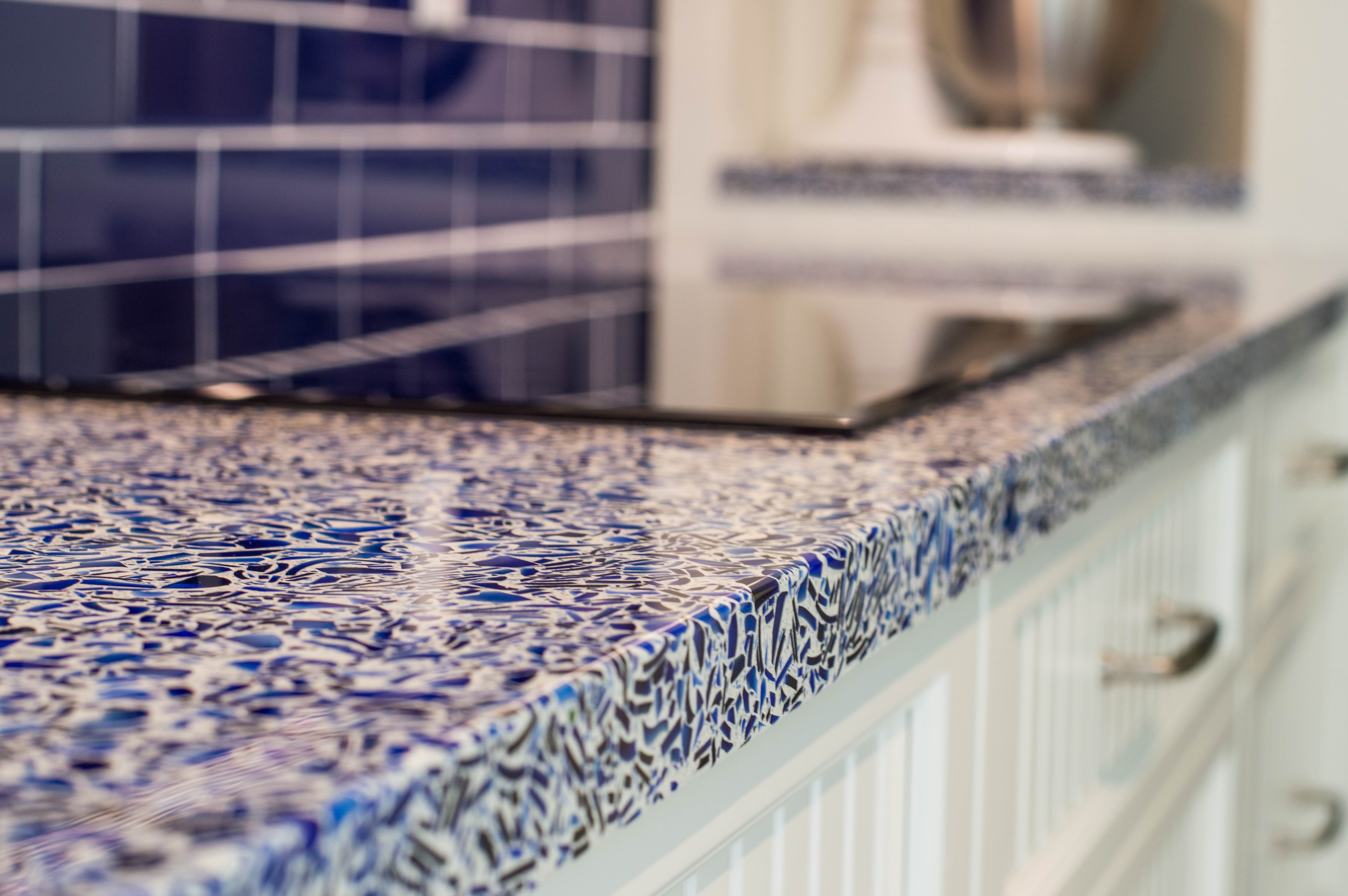 2-cobalt skye vetrazzo recycled glass countertops designed by waterview kitchens featuring crystal cabinets